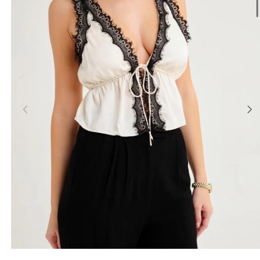 Rumored satin lace trim top. Cream and black. Small
